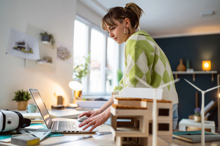 Young Gen Z woman at laptop